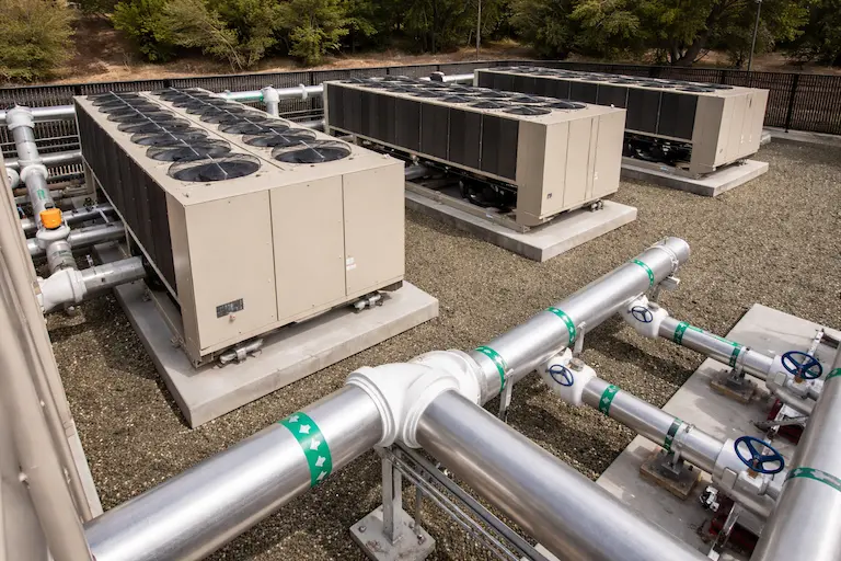 commercial chiller cooling tower system industrial piping.webp
