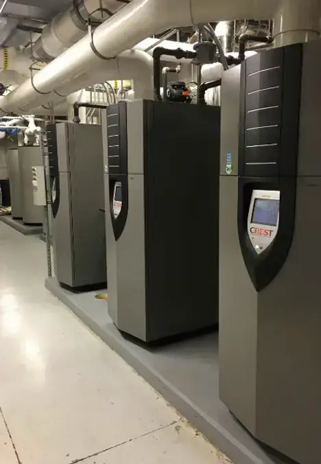commercial dual boiler installation office building mechanical room.webp
