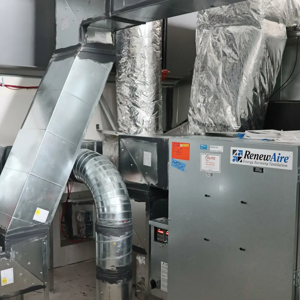 commercial ventilation system installation mechanical room.webp