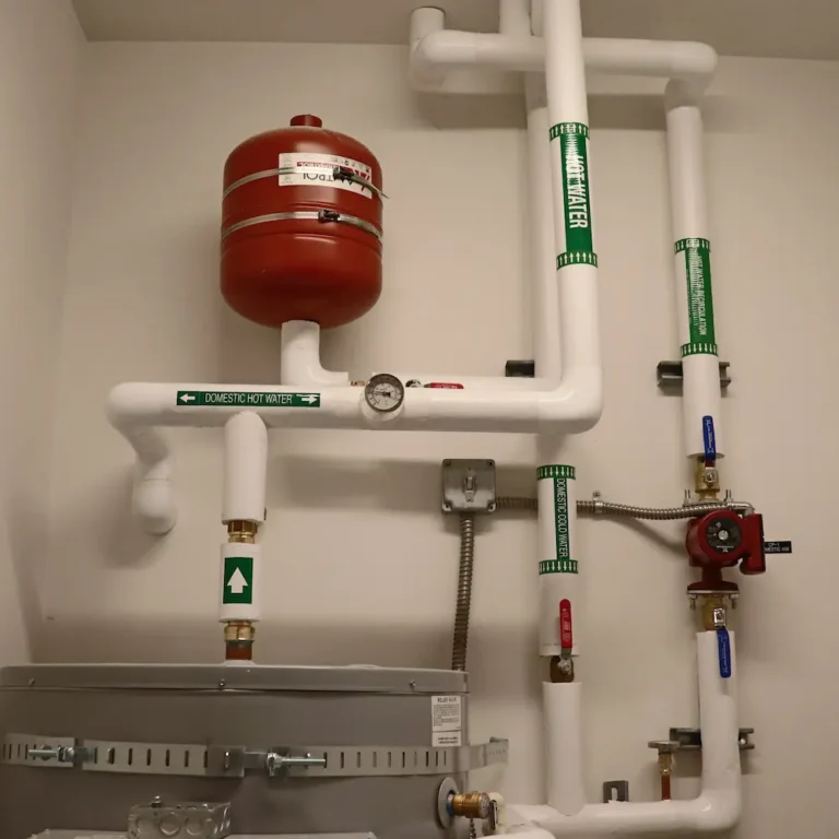 commercial water heater piping expansion tank mechanical room.webp